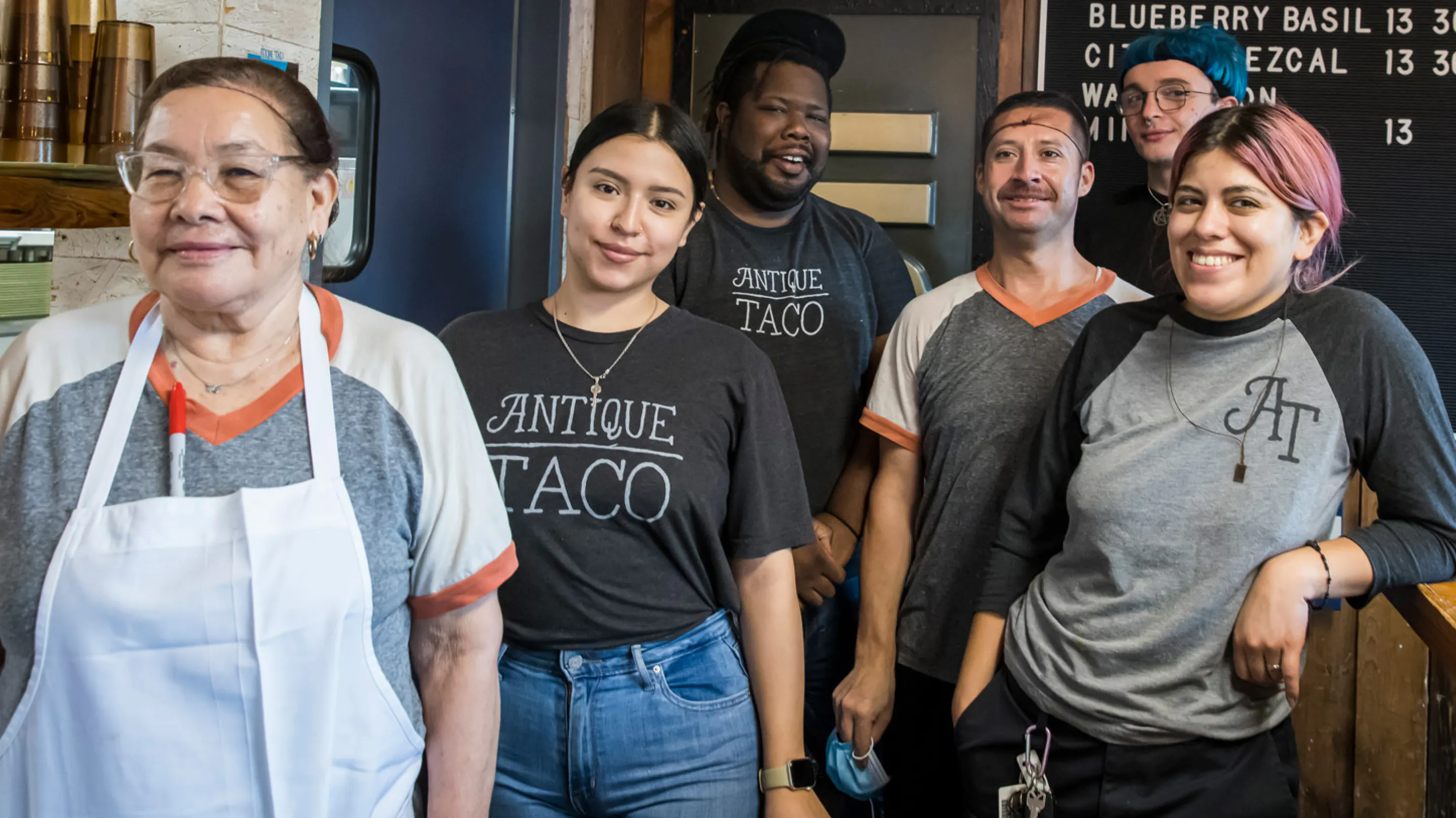 The owners of Antique Taco standing outside their restaurant