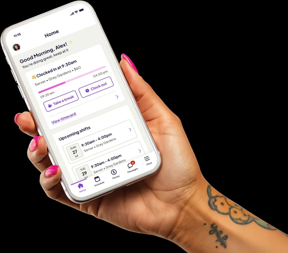 Hand holding a phone showing the Homebase app