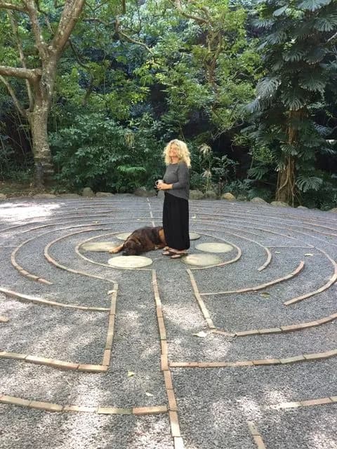 Eve Hogan arranging plants at The Sacred Garden.