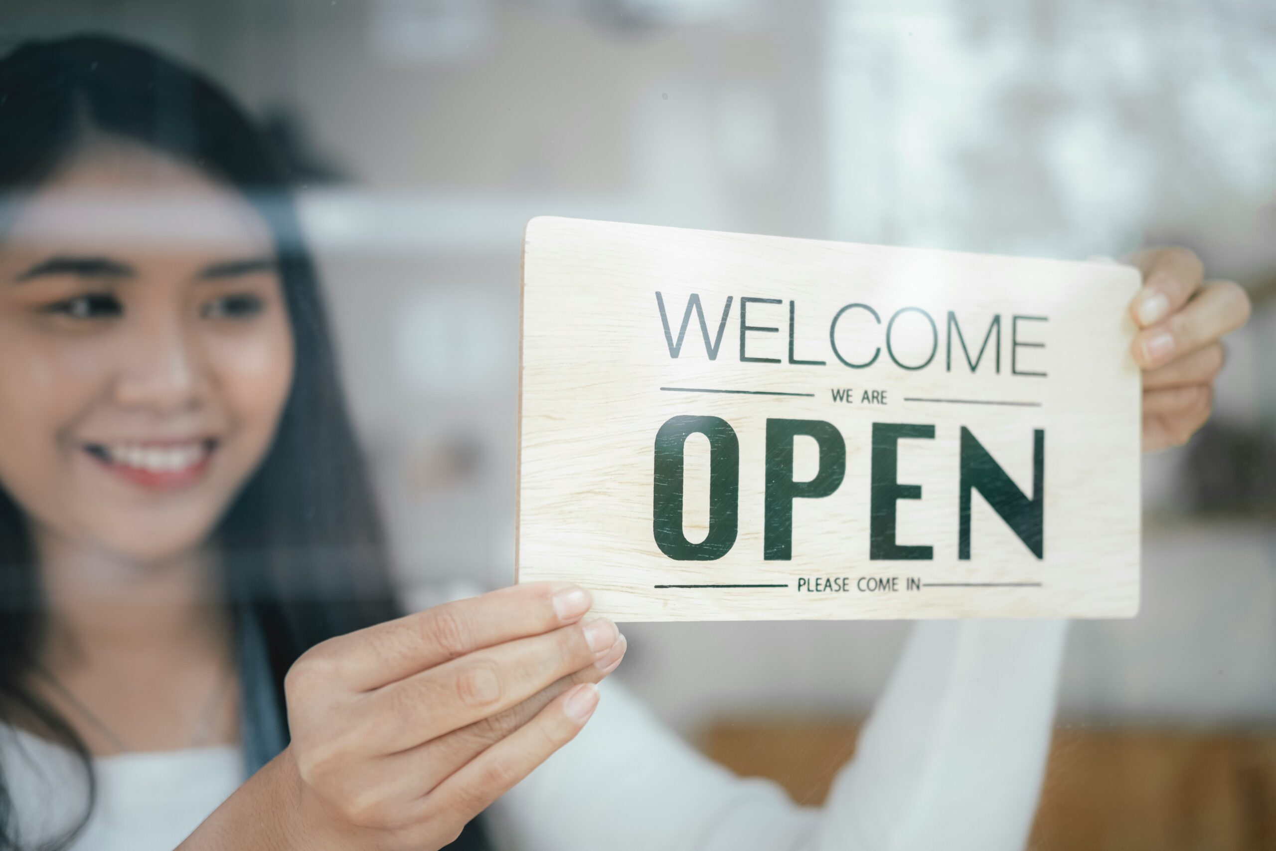 how-to-open-a-business-in-louisiana girl ready to welcome customers