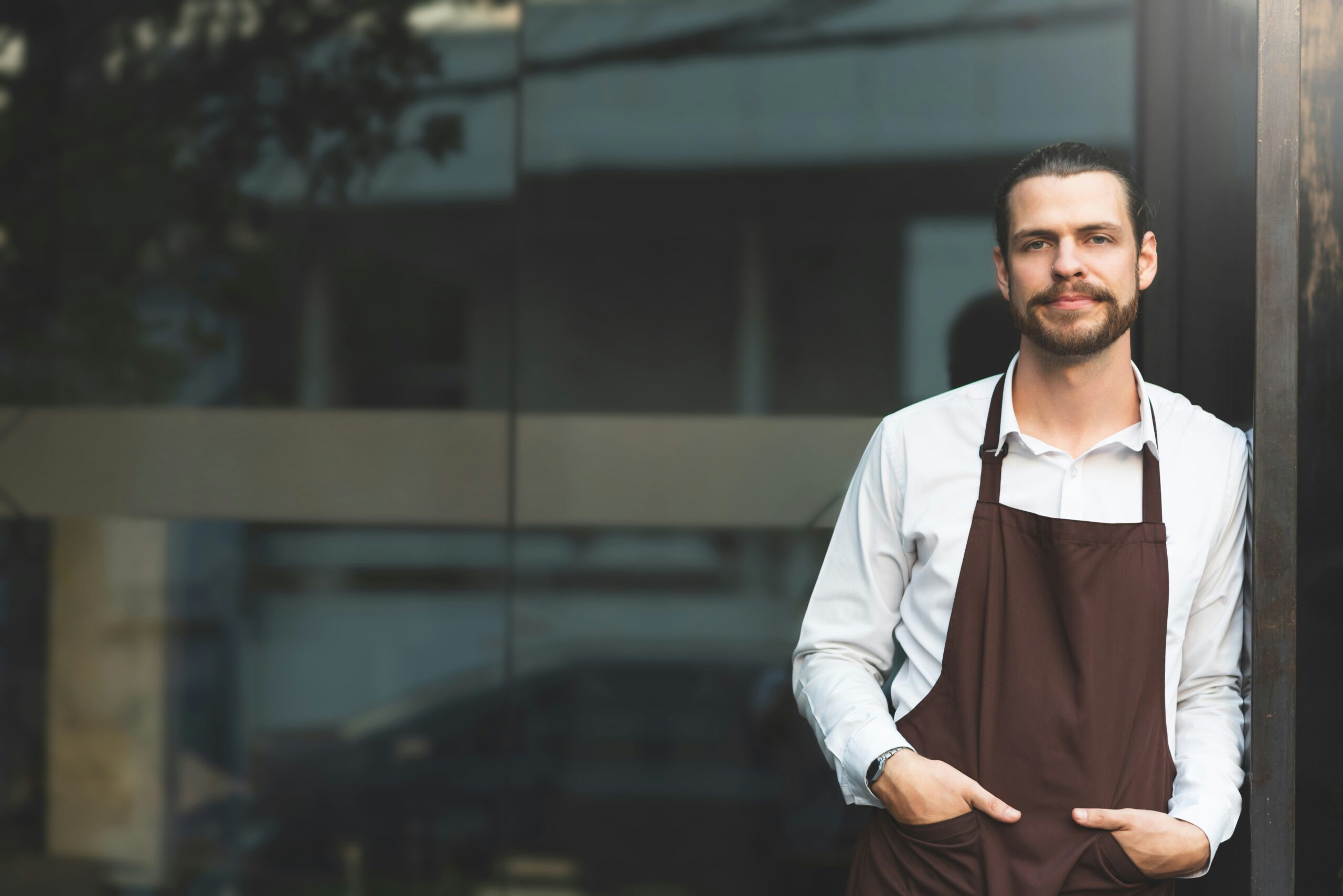 how to start a business in illinois - man outside a shop